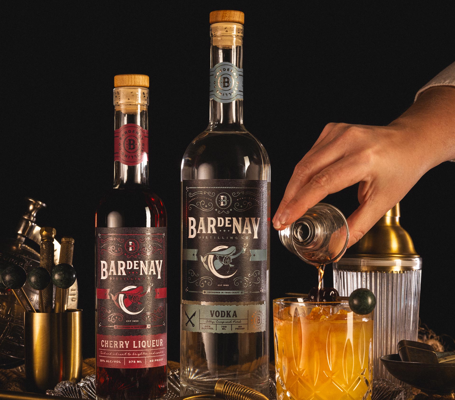 Pouring a Bardenay Cherry liqueur and vodka cocktail.