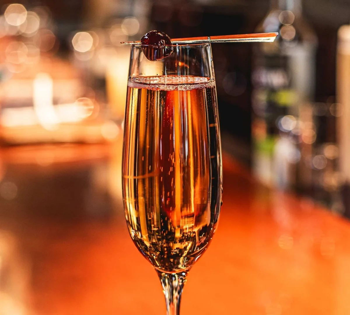 Bardenay Cherry champagne cocktail in a glass.